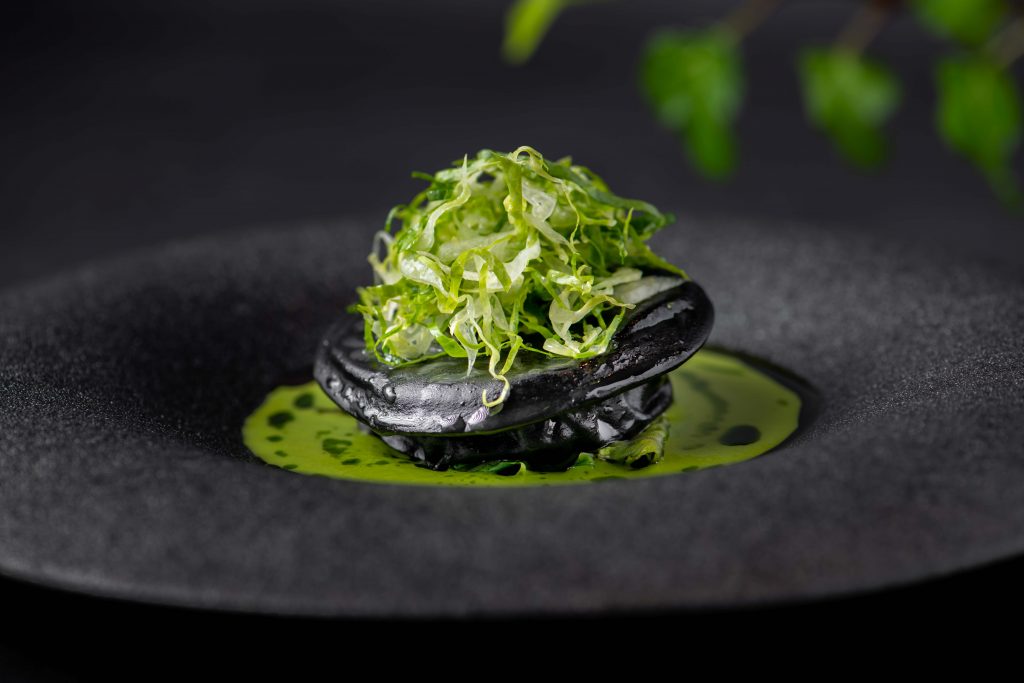 432707-432707-05_squid-ink-raviolo-fermented-romaine-romaine-veloute-snow-crab-1024x683.jpg